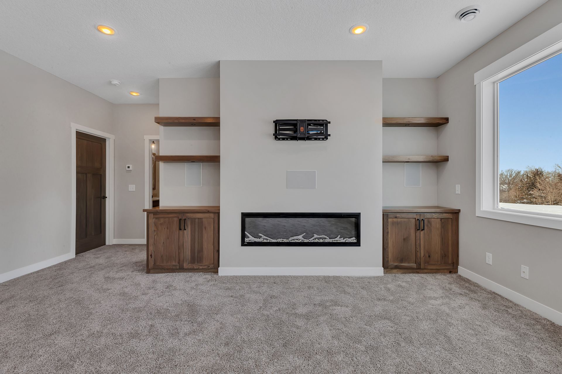 There is a fireplace in the middle of the room.