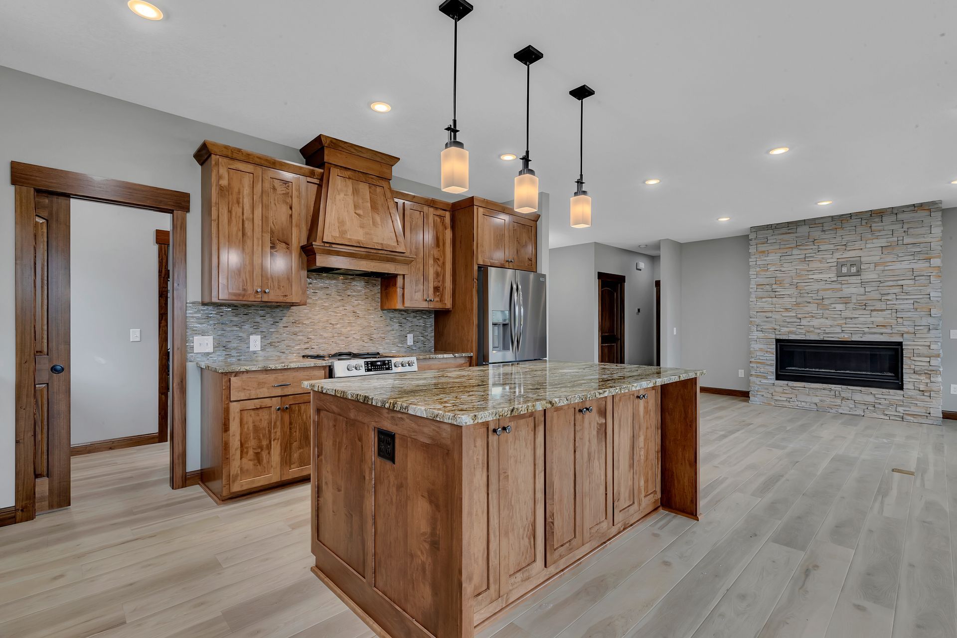 There is a large island in the middle of the kitchen.