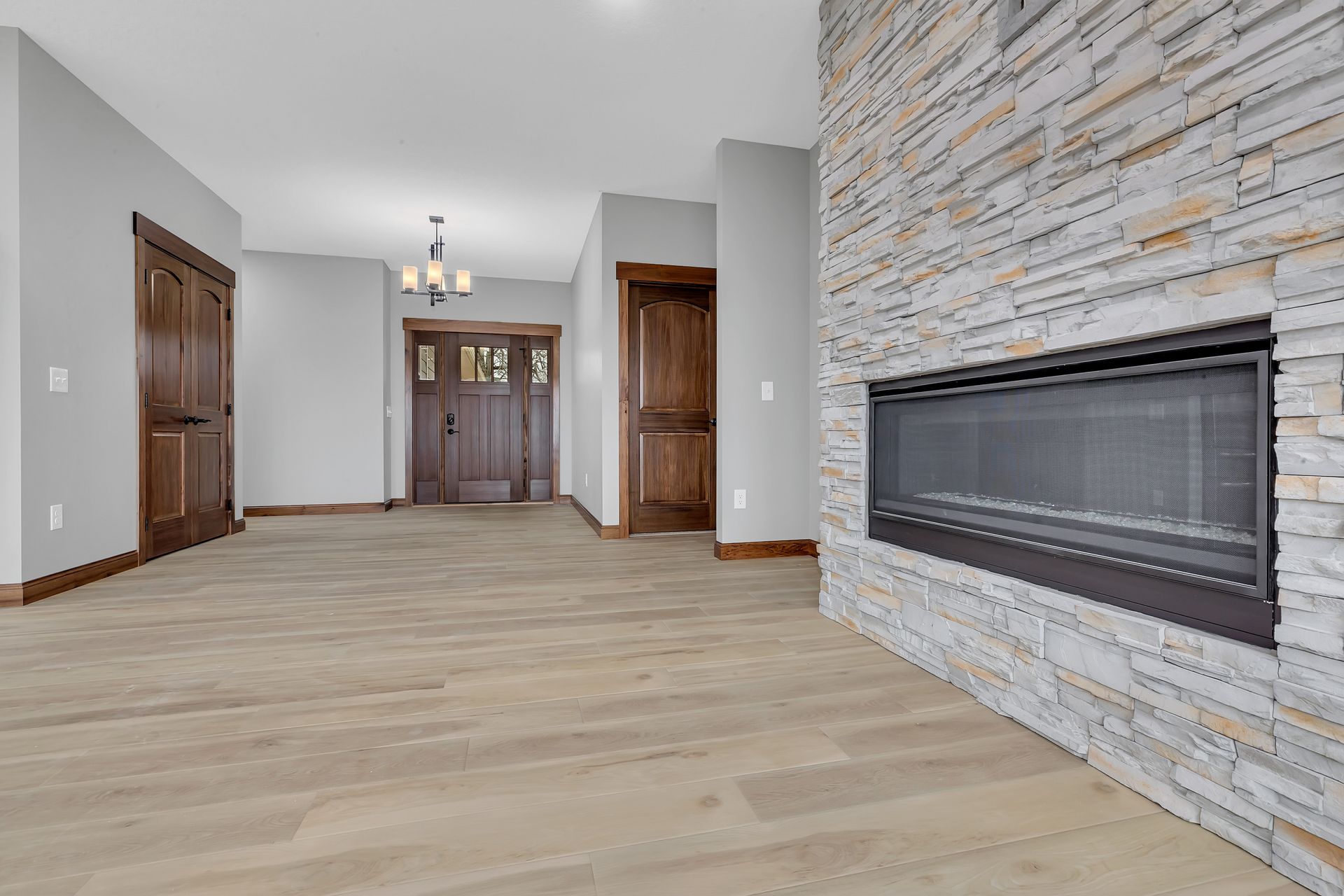There is a fireplace in the middle of the living room.