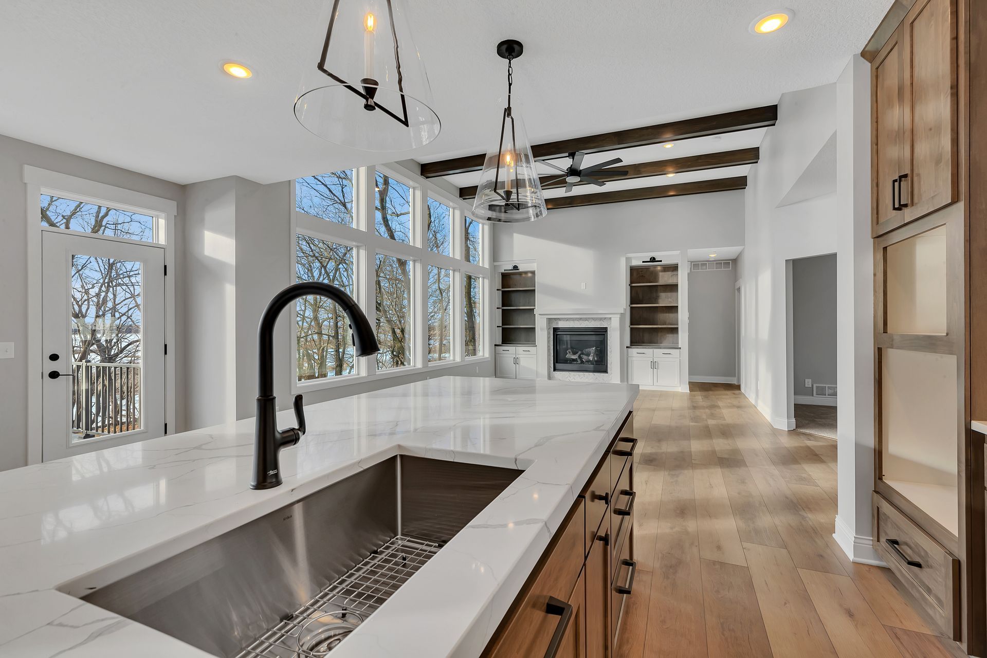 A kitchen with a stainless steel sink and a faucet.