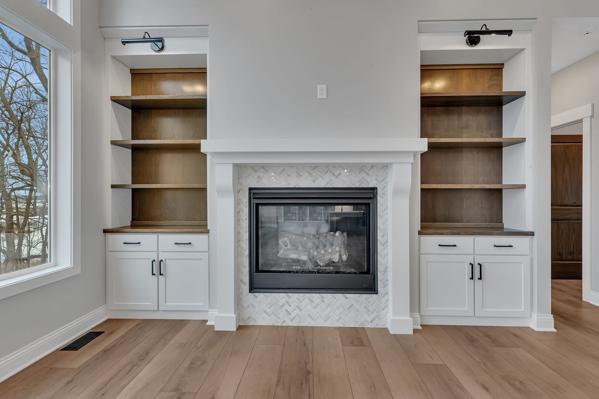 There is a fireplace in the middle of the room.