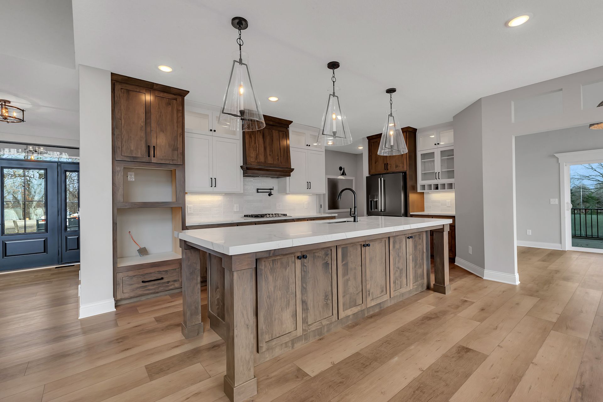 A kitchen with a large island in the middle of it