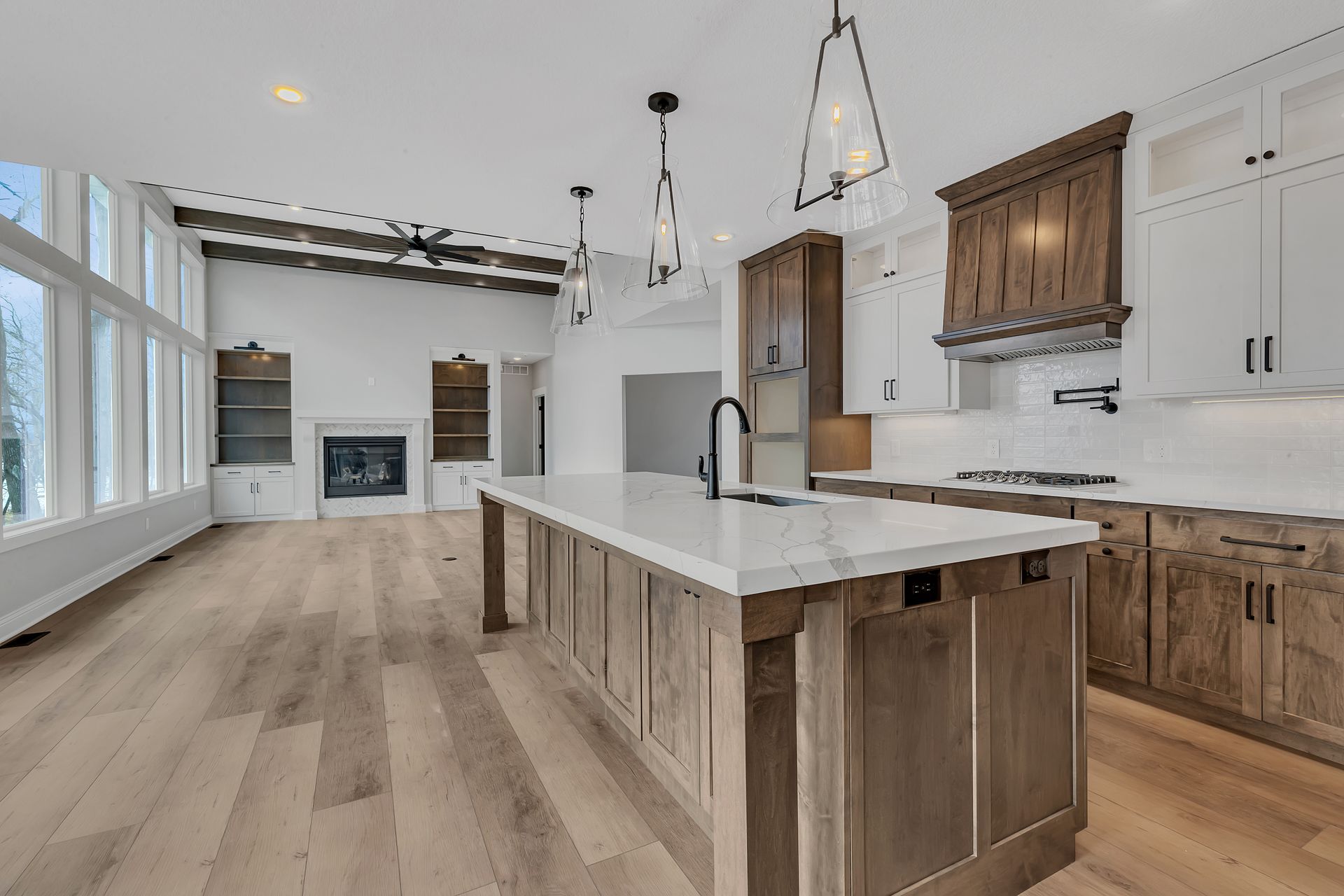 There is a large island in the middle of the kitchen.