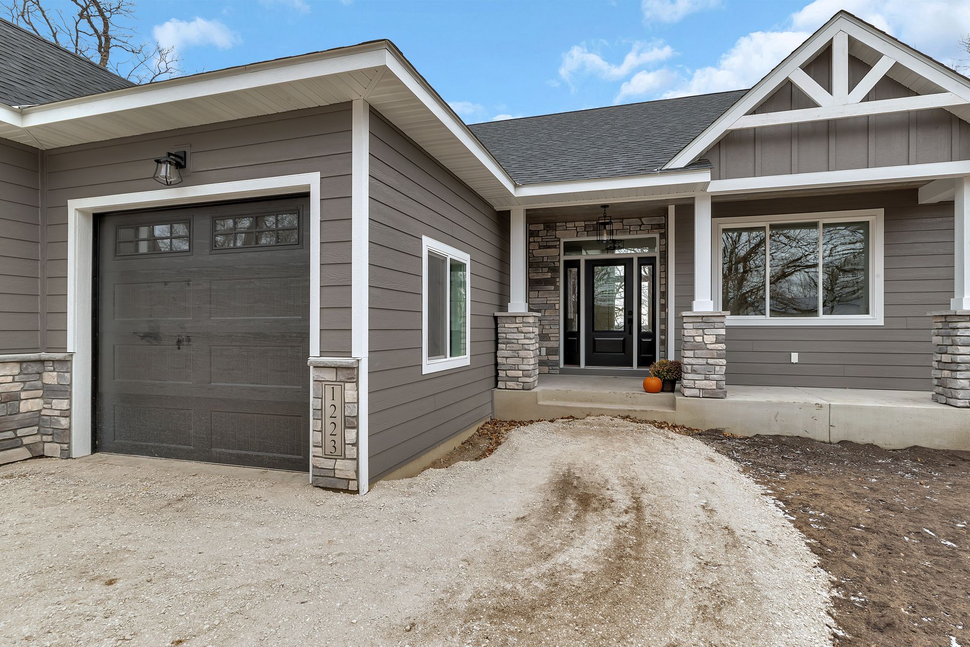 The front of a house with a garage and a driveway
