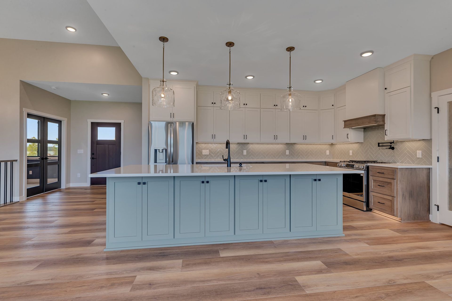 There is a large island in the middle of the kitchen.