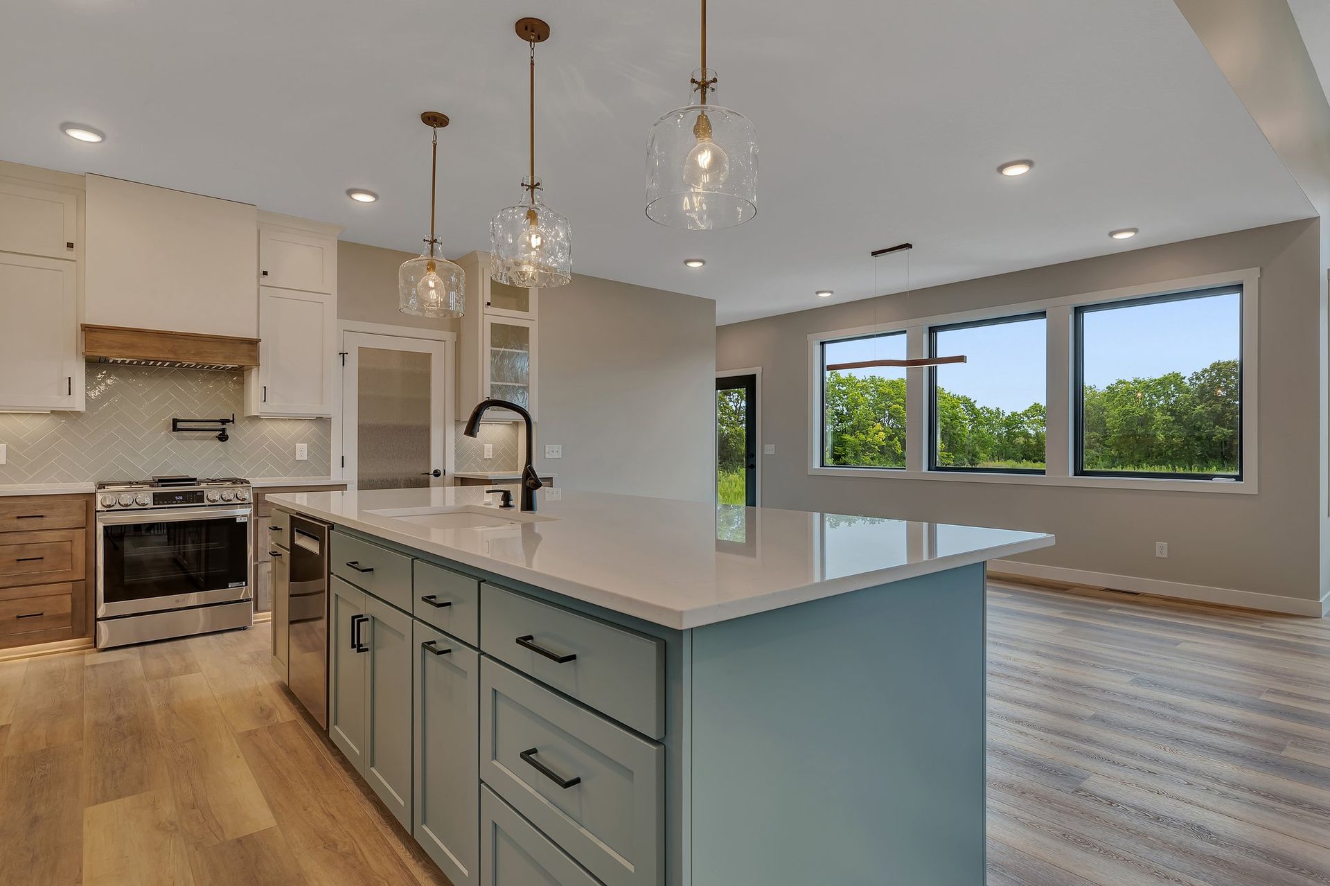 There is a large island in the middle of the kitchen.