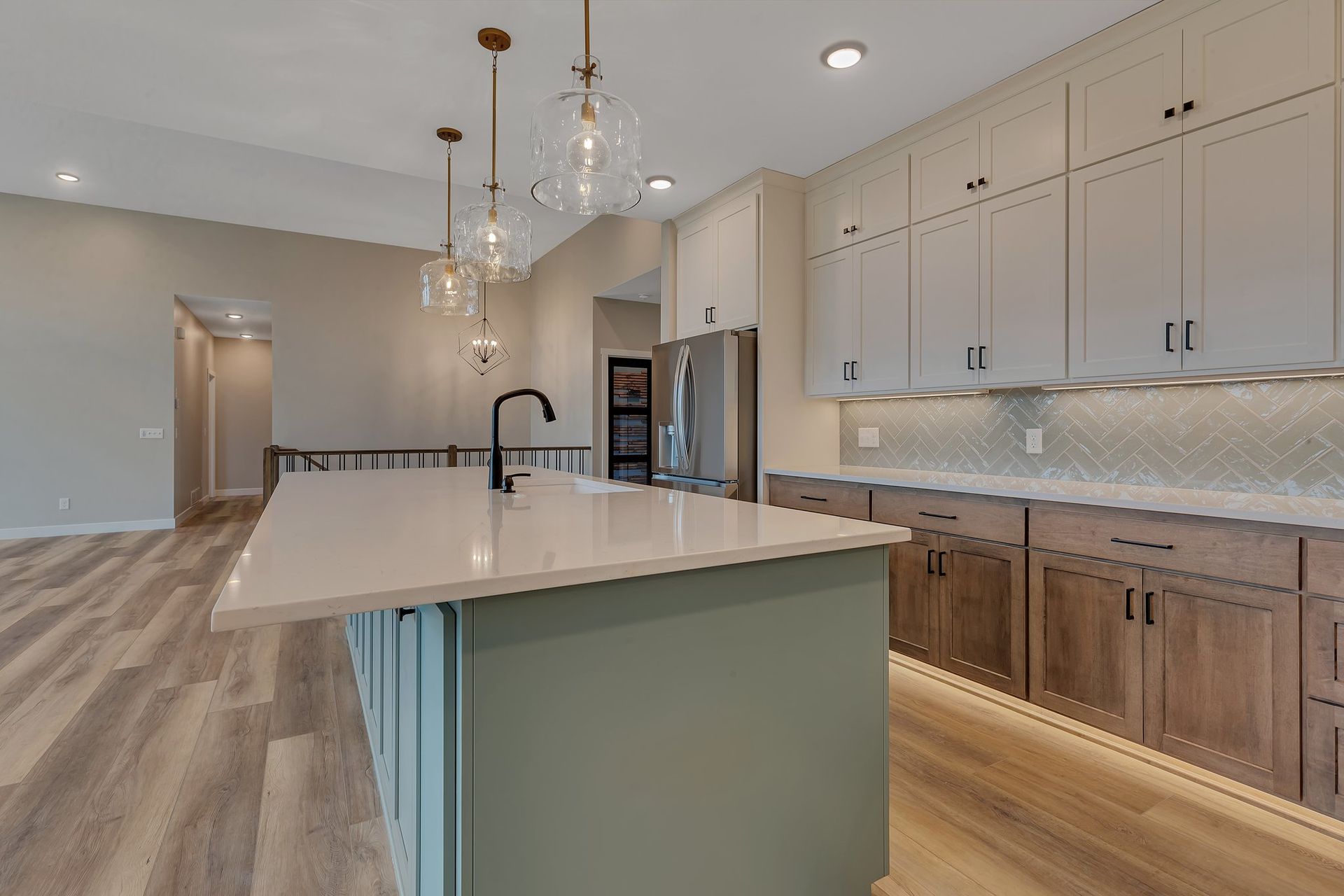 There is a large island in the middle of the kitchen.