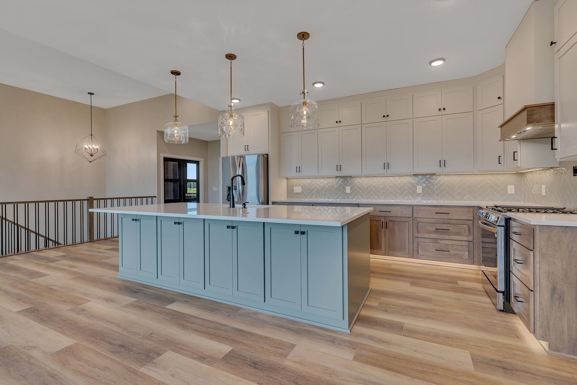 There is a large island in the middle of the kitchen.