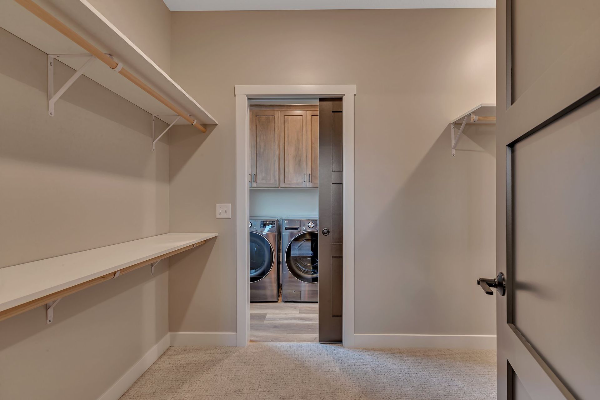 A laundry room with a washer and dryer in it