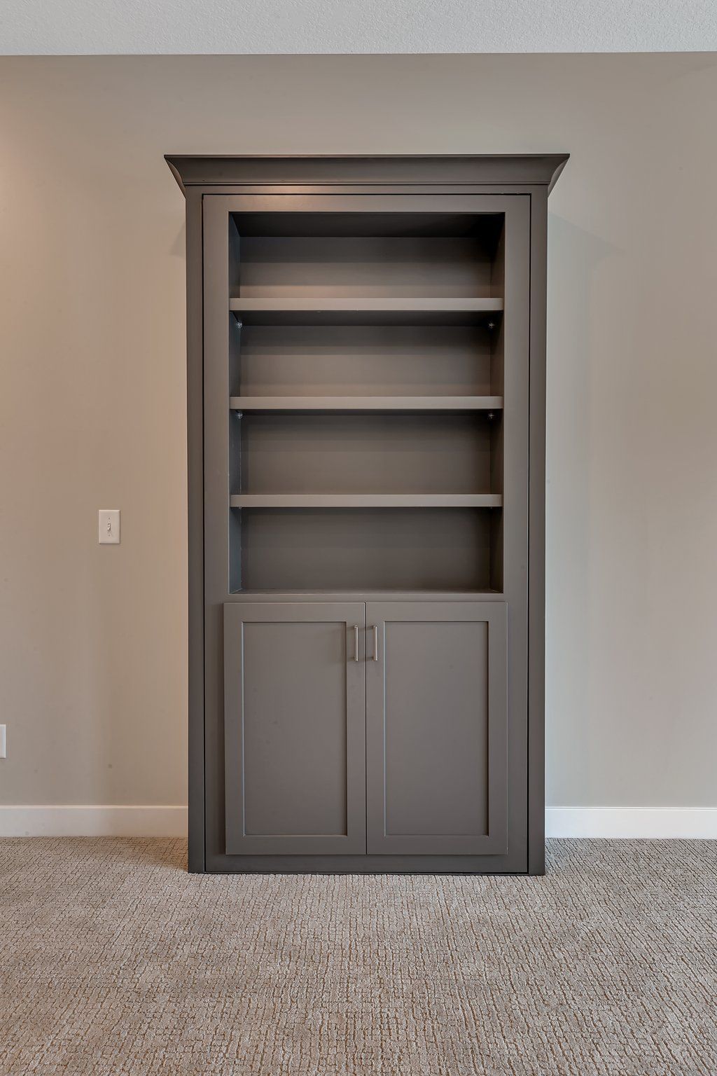 There is a bookshelf in the middle of the room.