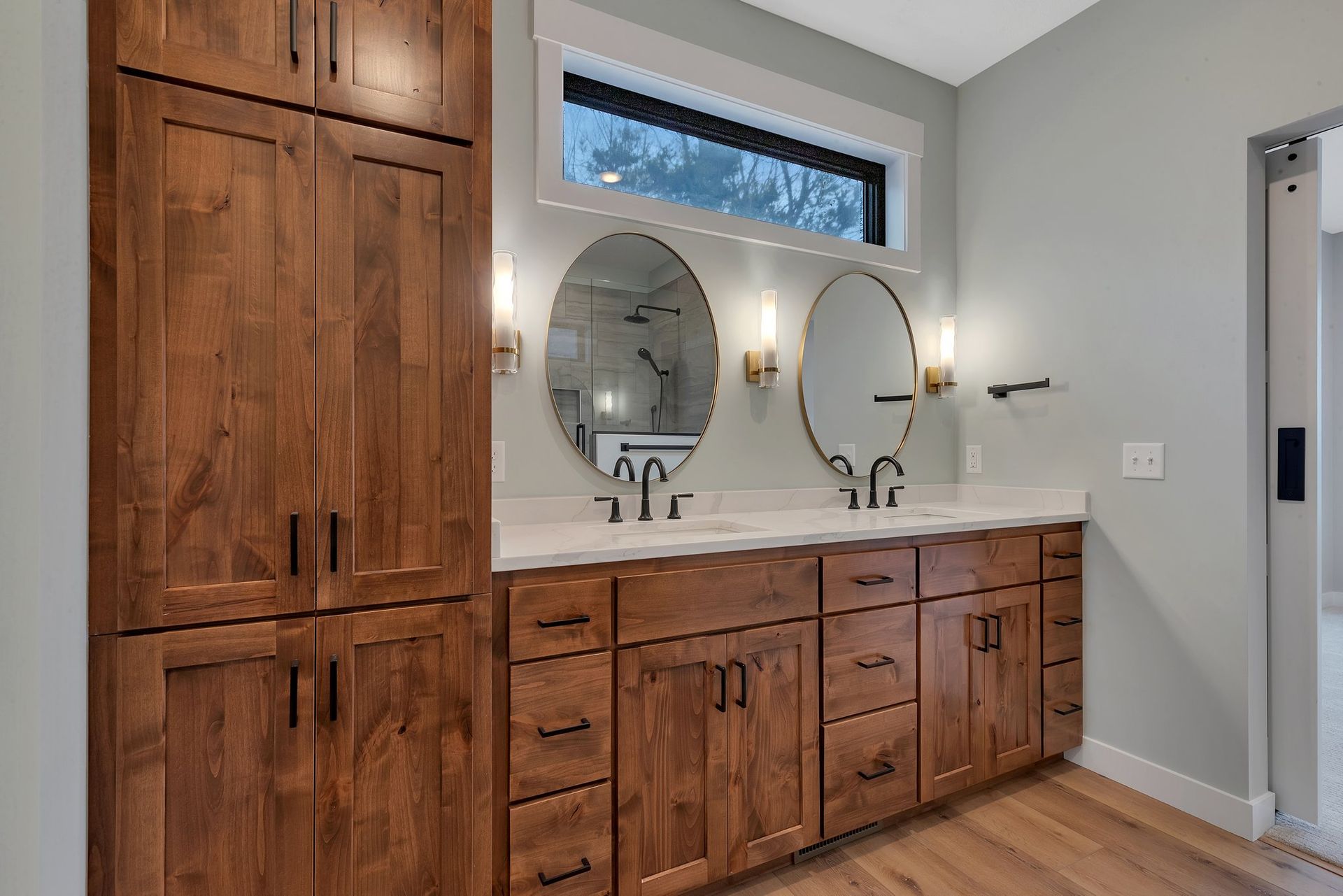 A bathroom with two sinks and two mirrors.