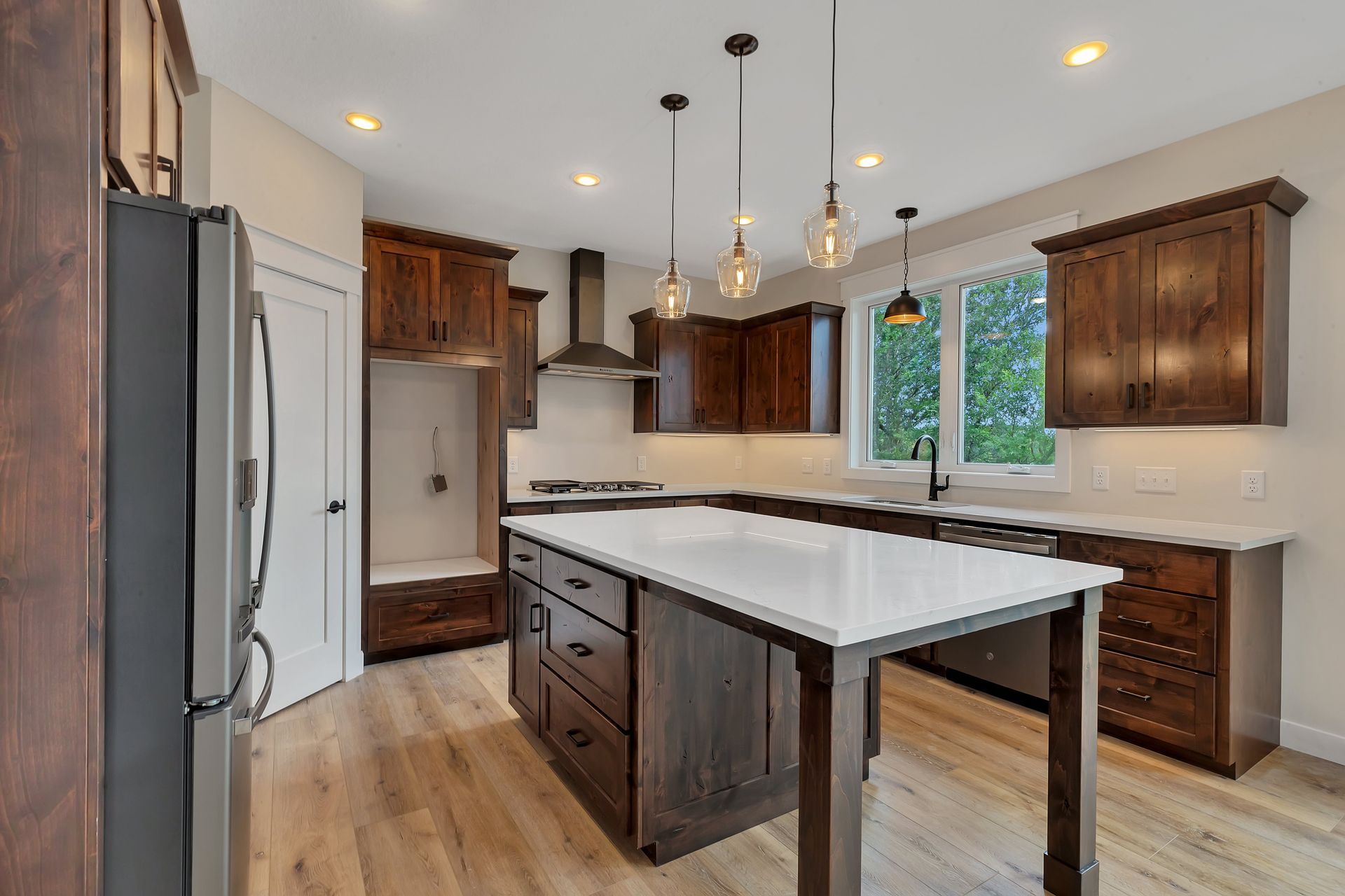 A kitchen with a large island in the middle of it.