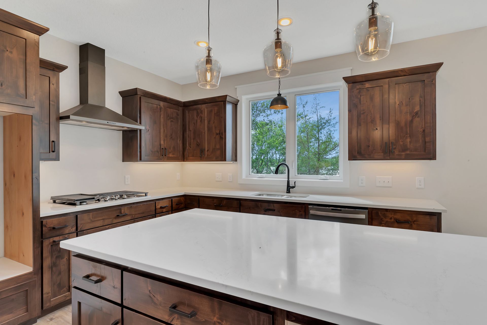 There is a large island in the middle of the kitchen.