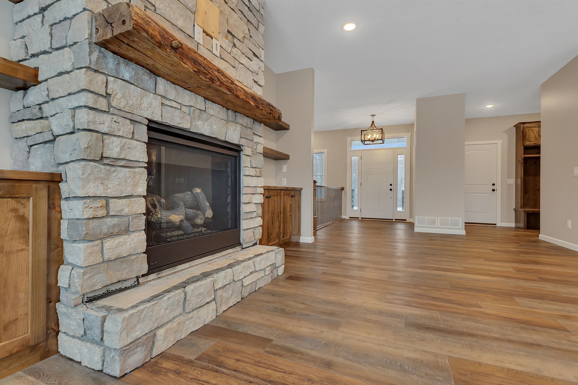 There is a fireplace in the middle of the living room.