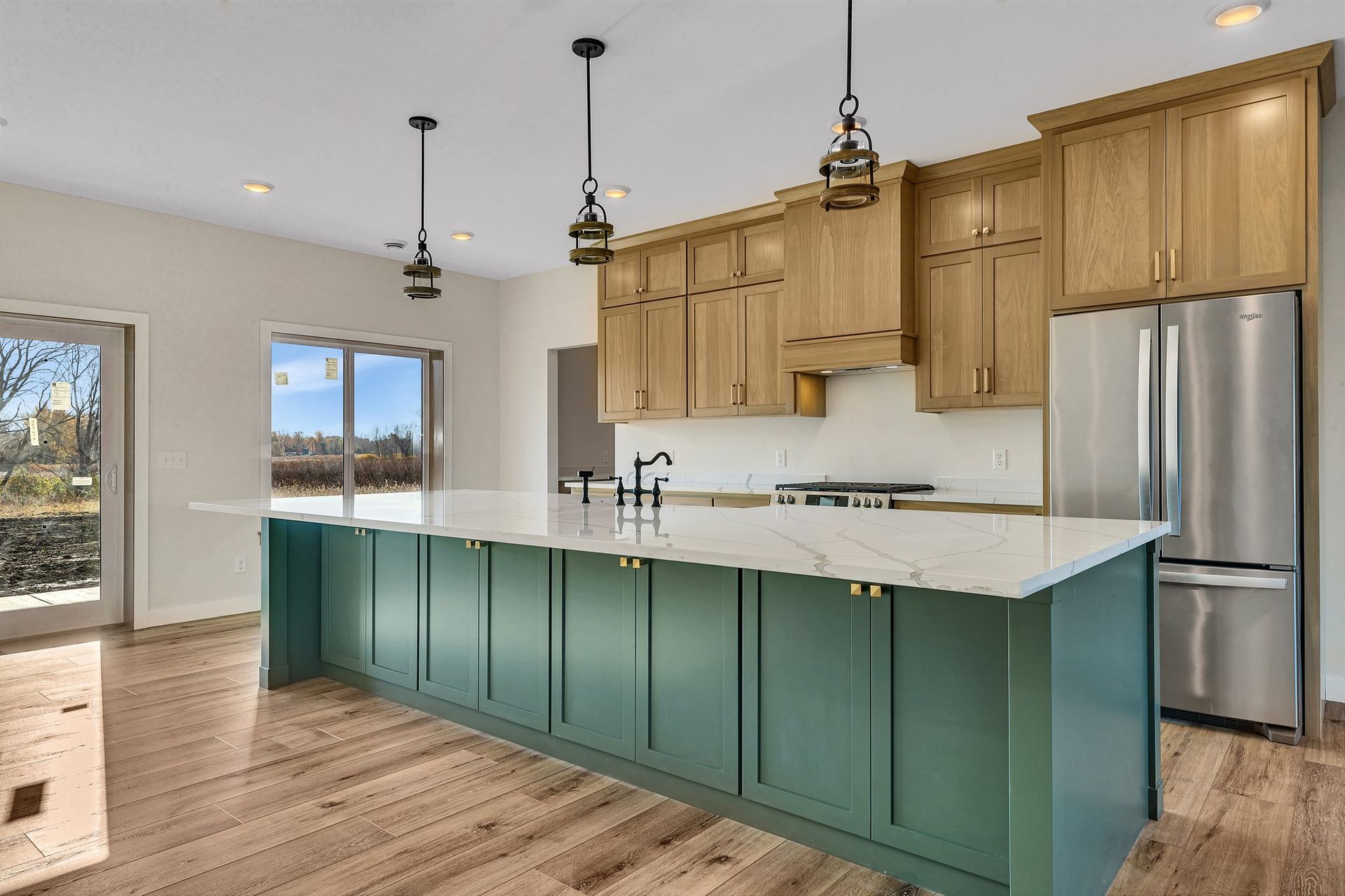 There is a large island in the middle of the kitchen.
