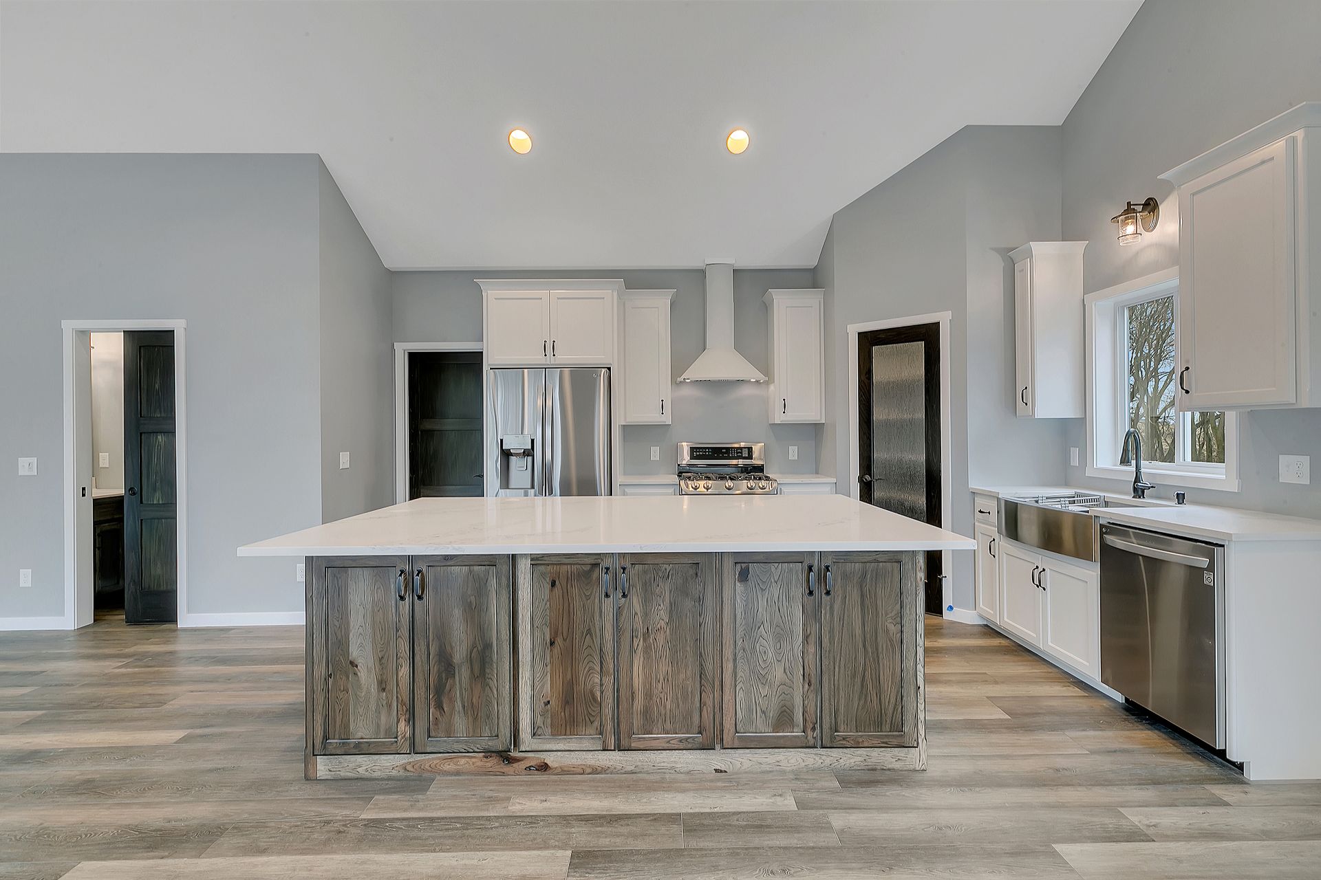 There is a large island in the middle of the kitchen.
