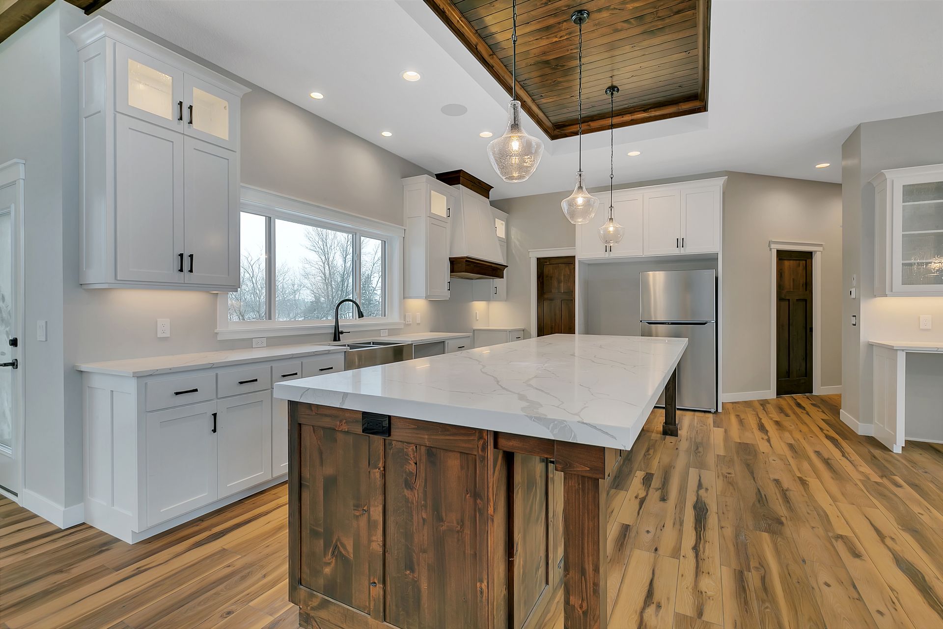 There is a large island in the middle of the kitchen.