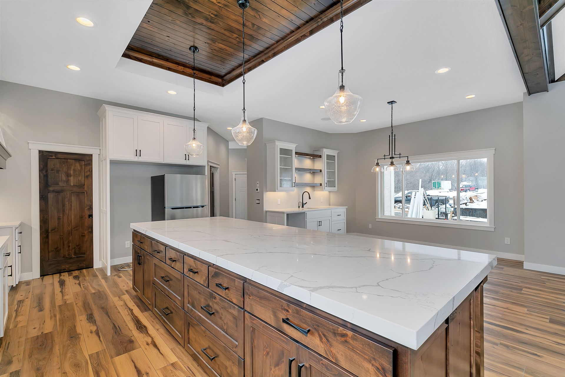 There is a large island in the middle of the kitchen.