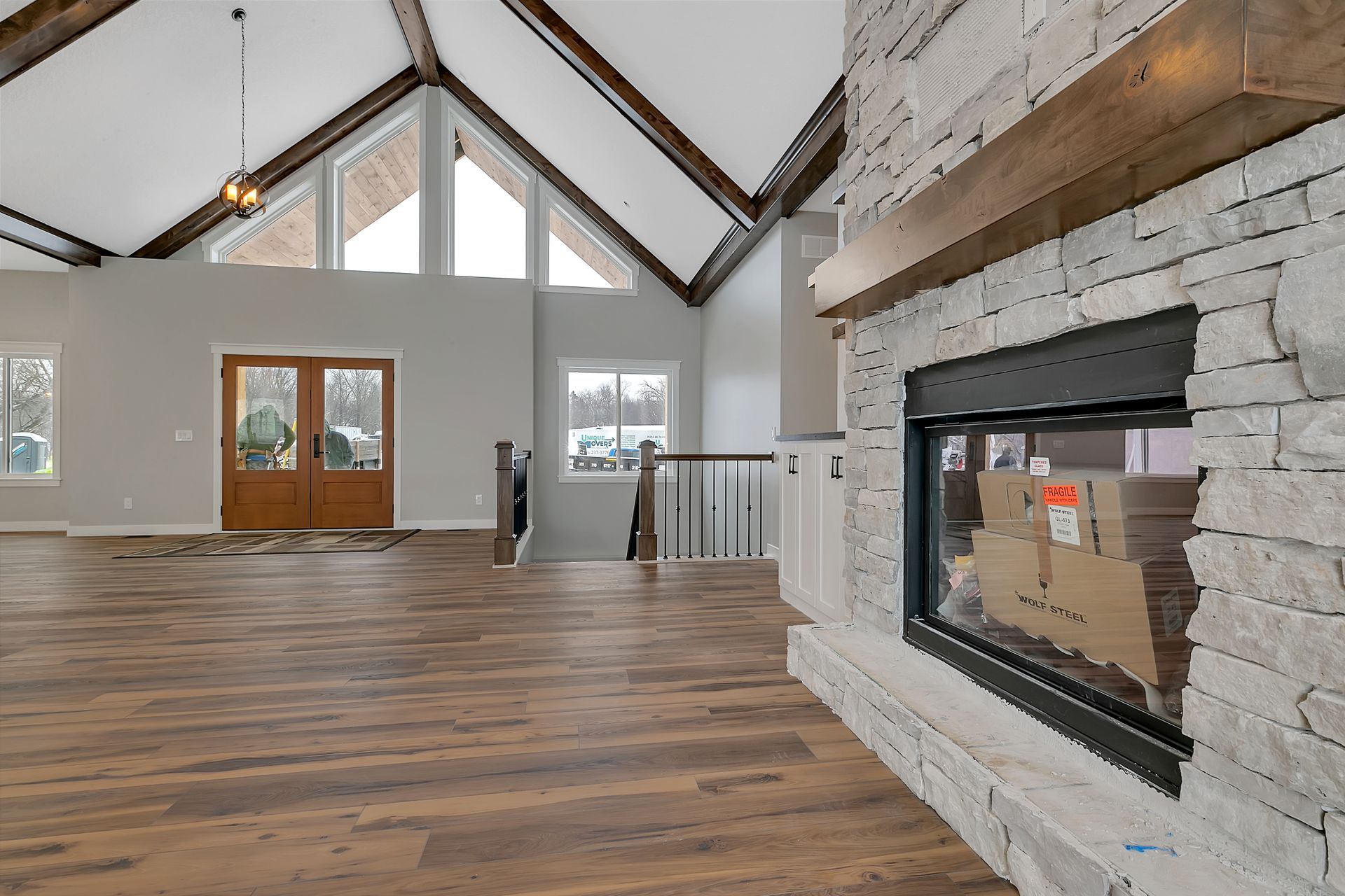 There is a fireplace in the middle of the room.