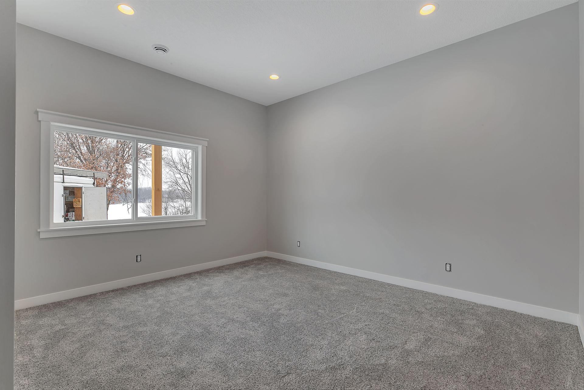 There is a large window in the middle of the room.
