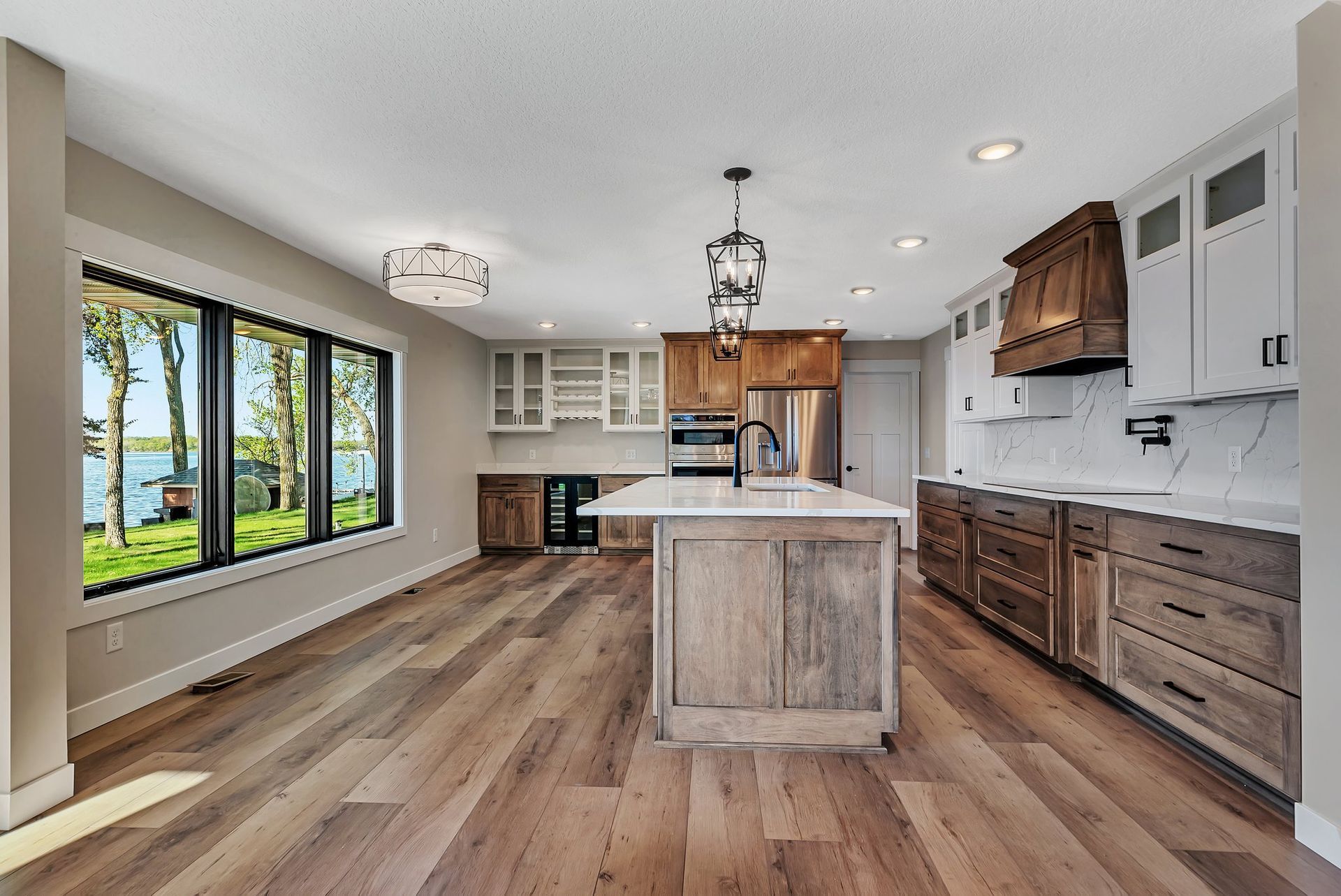 A kitchen with a large island in the middle of the room.