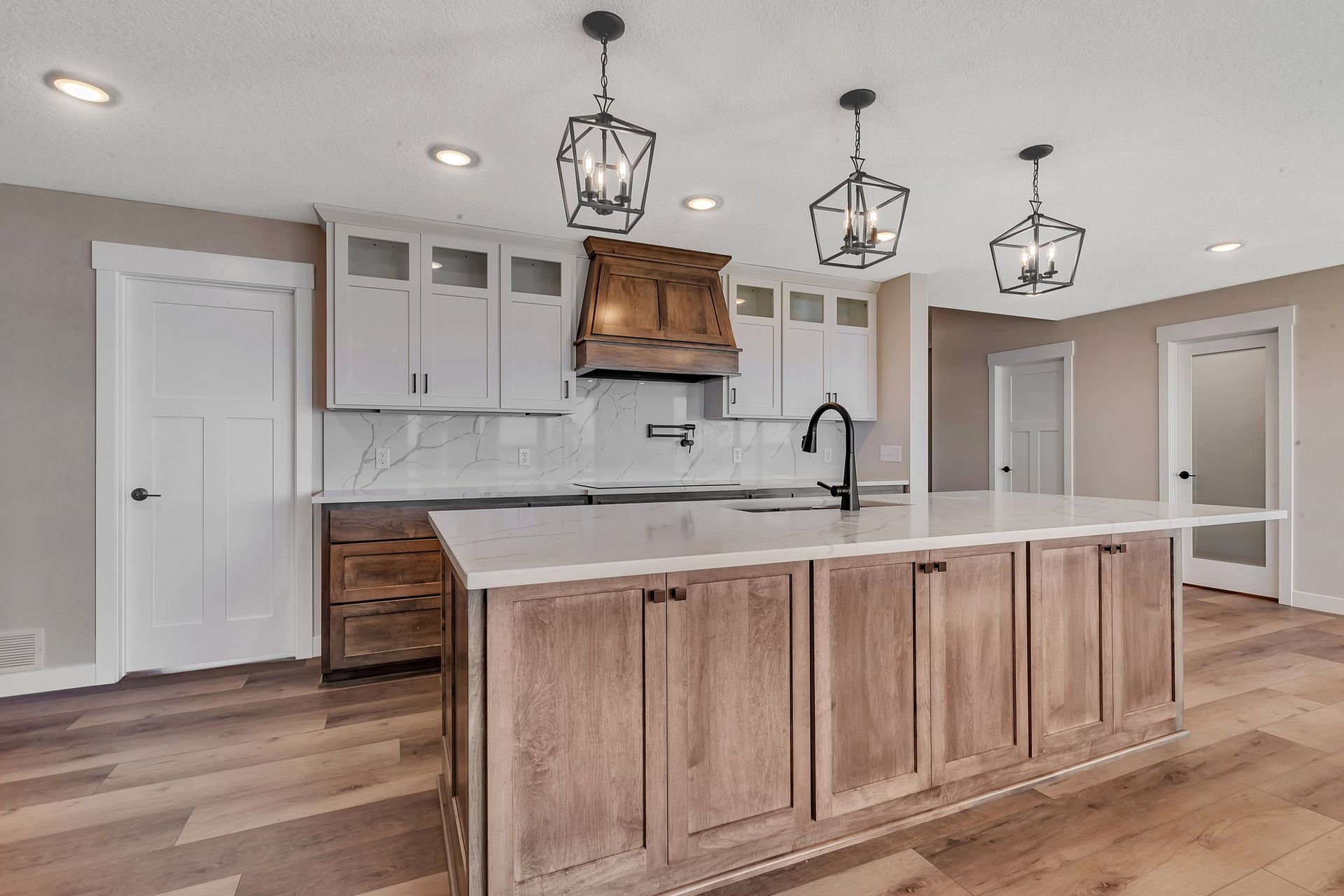 There is a large island in the middle of the kitchen.