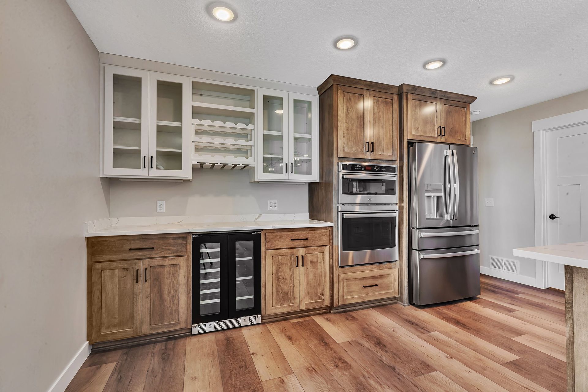 A kitchen with wooden cabinets and stainless steel appliances.