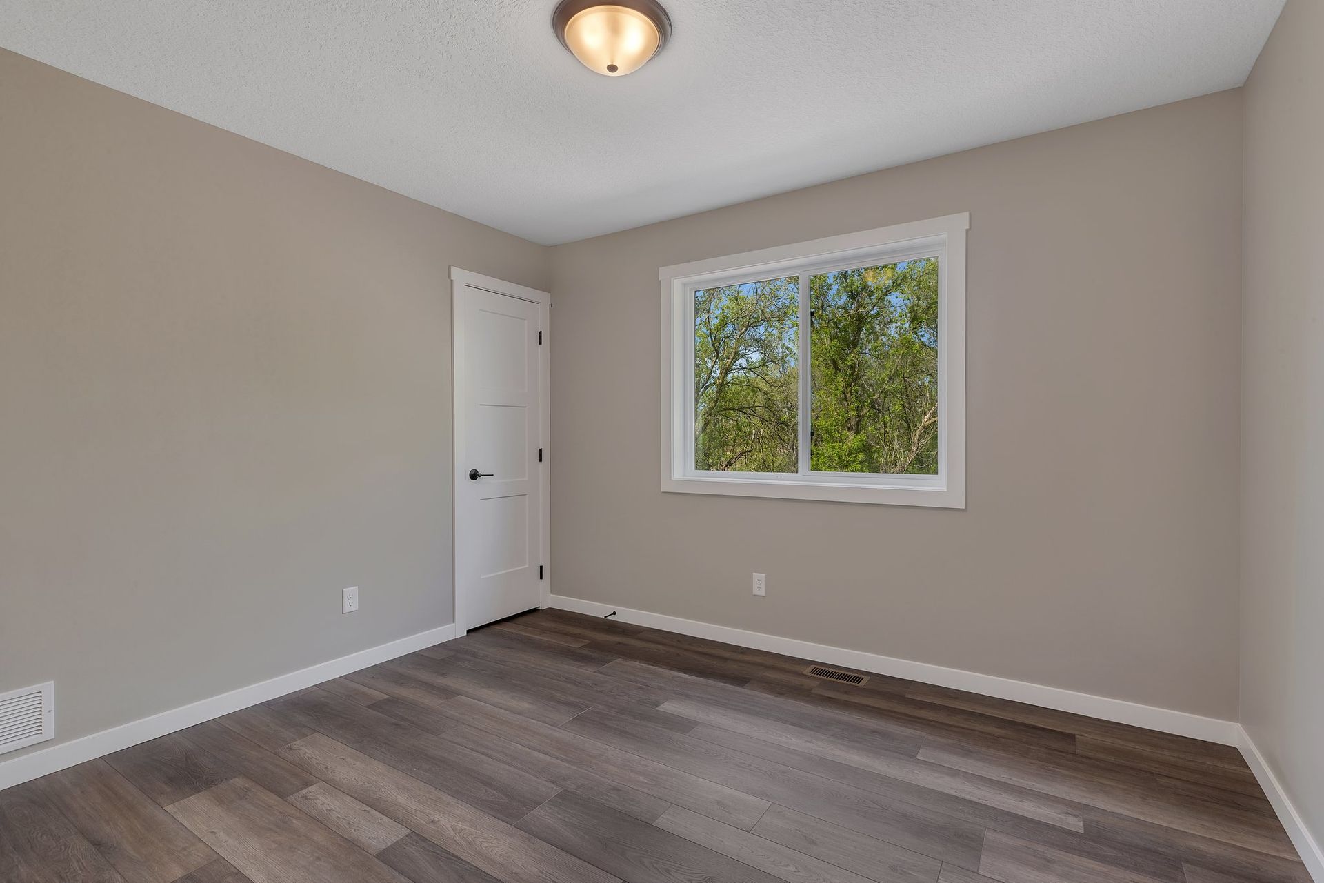 There is a large window in the middle of the room.