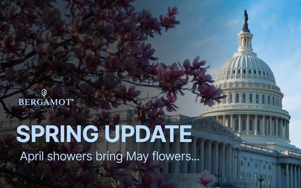 The US Capitol building visible behind blooming spring trees, with text overlay reading: SPRING UPDATE April showers...