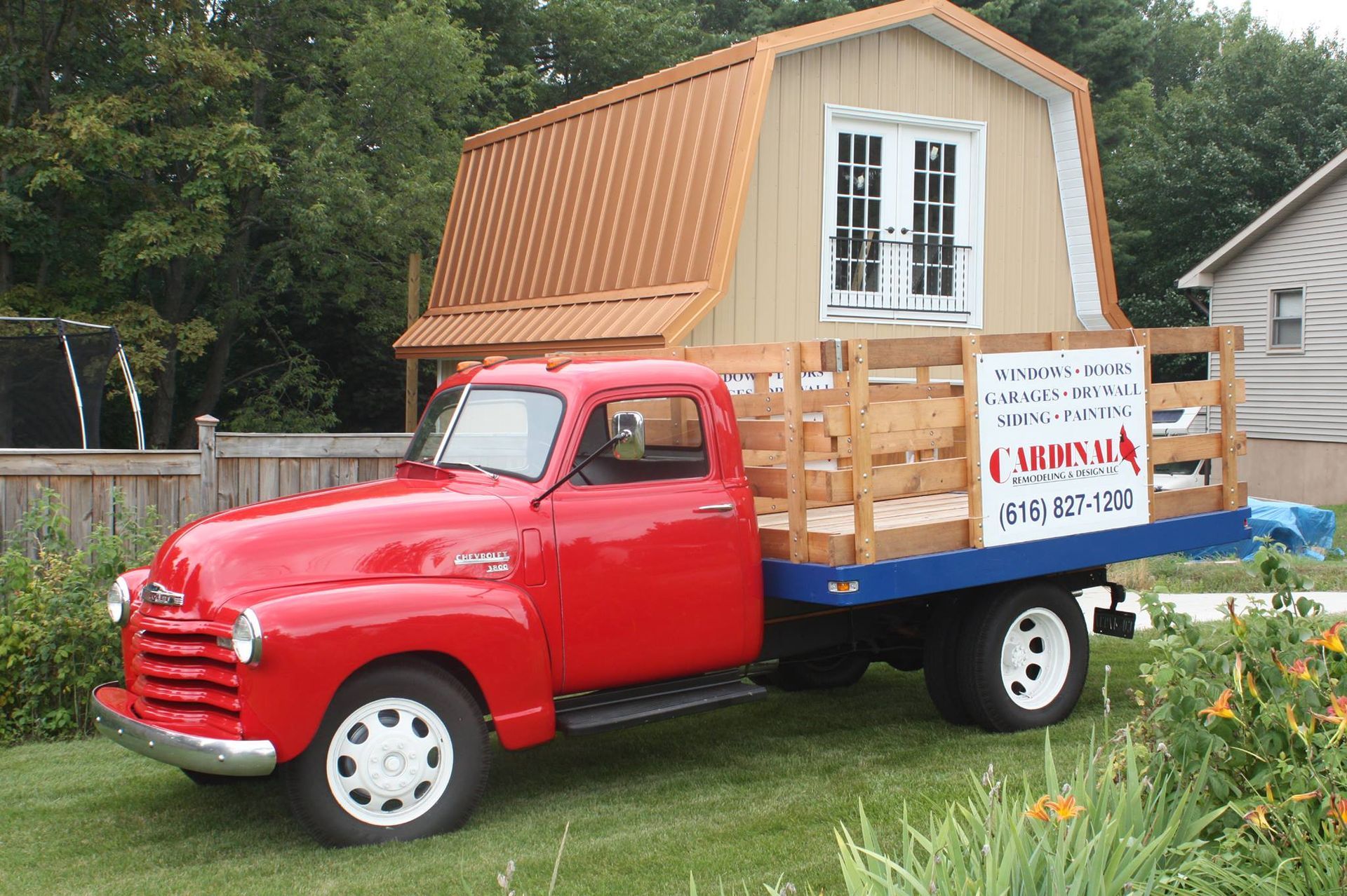 A red truck with a sign on the back that says chapul