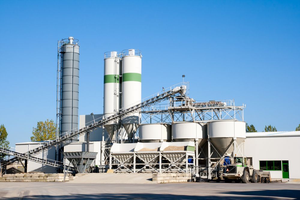 Industrial Cement Plant with Silos, Conveyor Belts, and White Storage Tanks — Lohman Contracting in Emerald, QLD