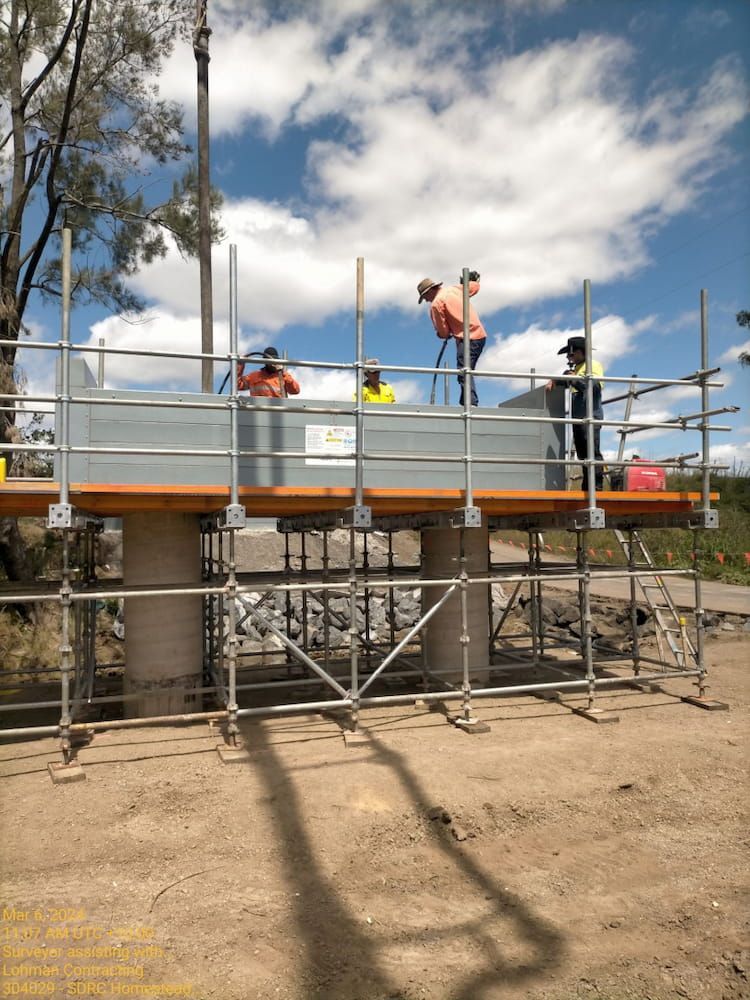 A Group Of Construction Workers Are Working On A Bridge — Lohman Contracting in Tamworth, NSW