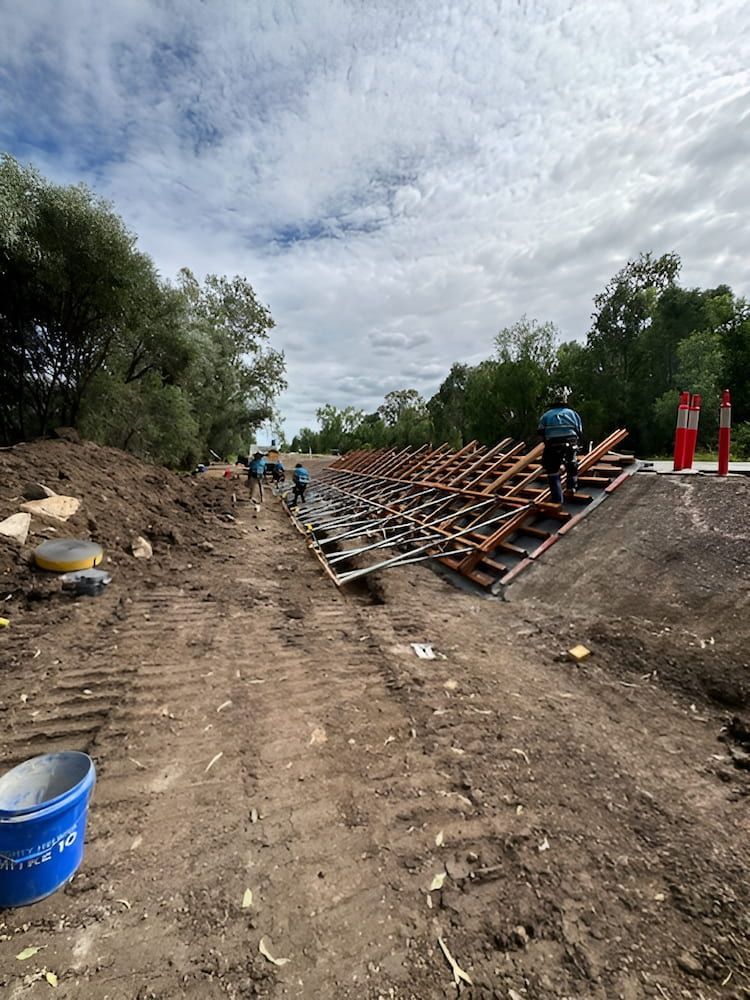 A Construction Site With A Lot Of Dirt And Trees — Lohman Contracting in Emerald, QLD