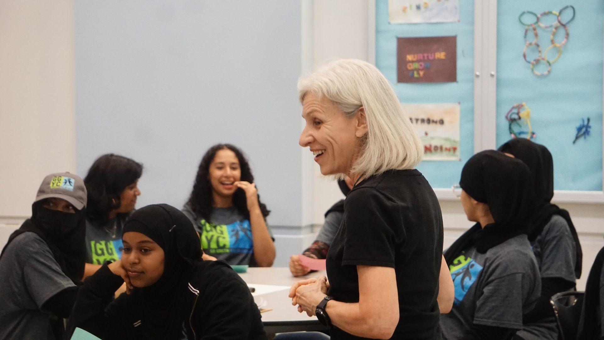 A women is teaching a group of students about careers.