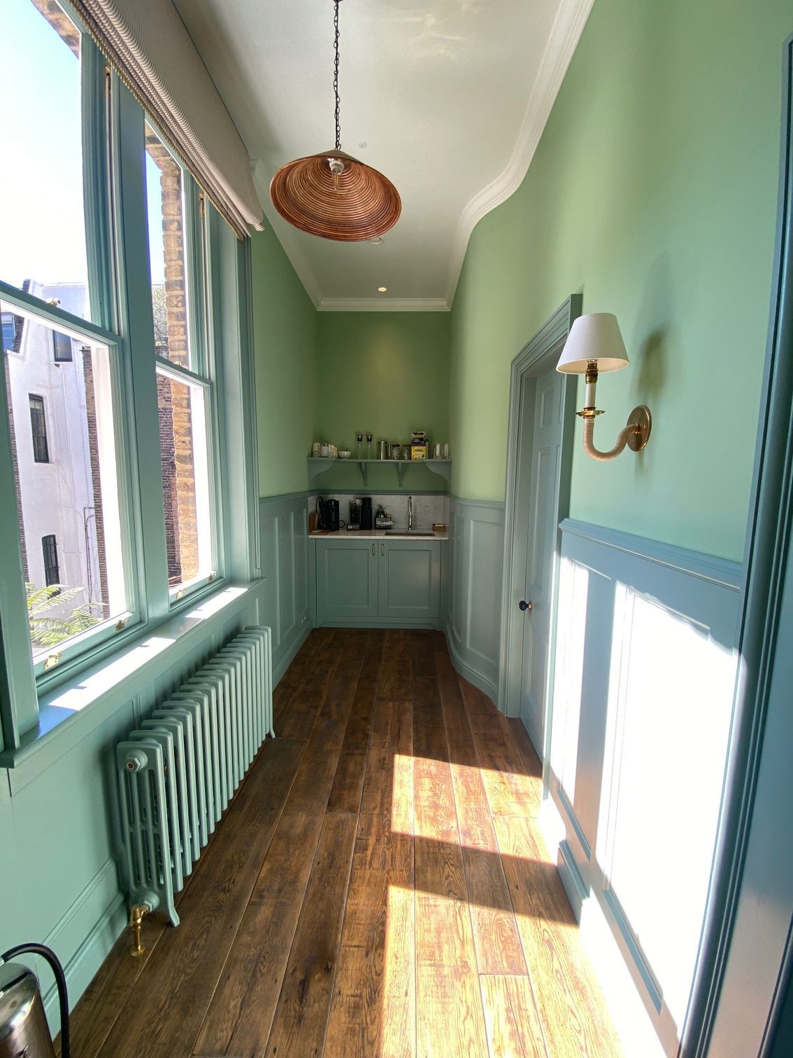 renovated room with green walls