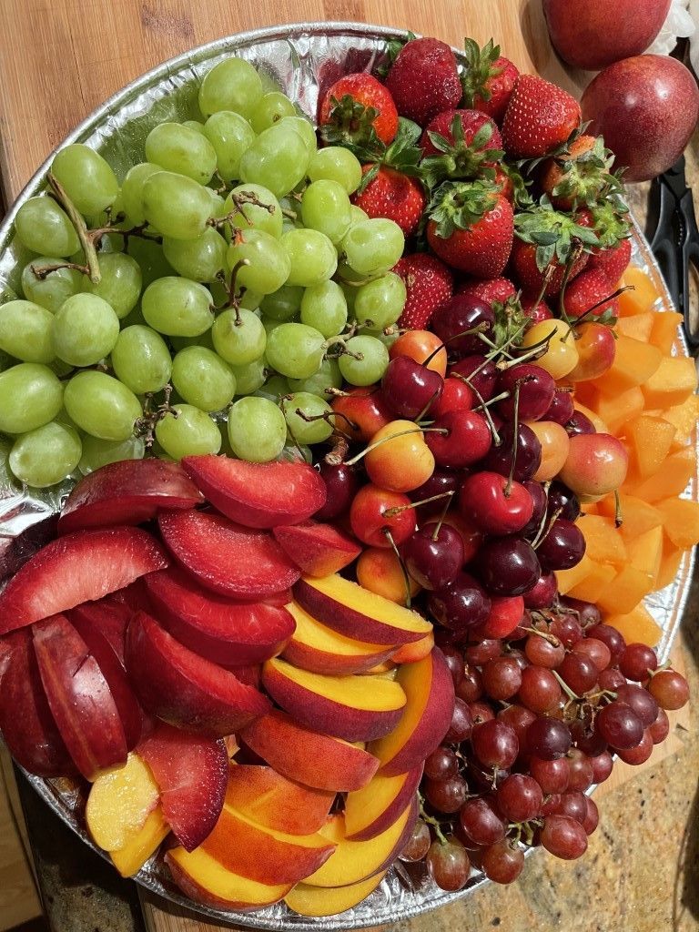 There are many different types of fruit on the plate.