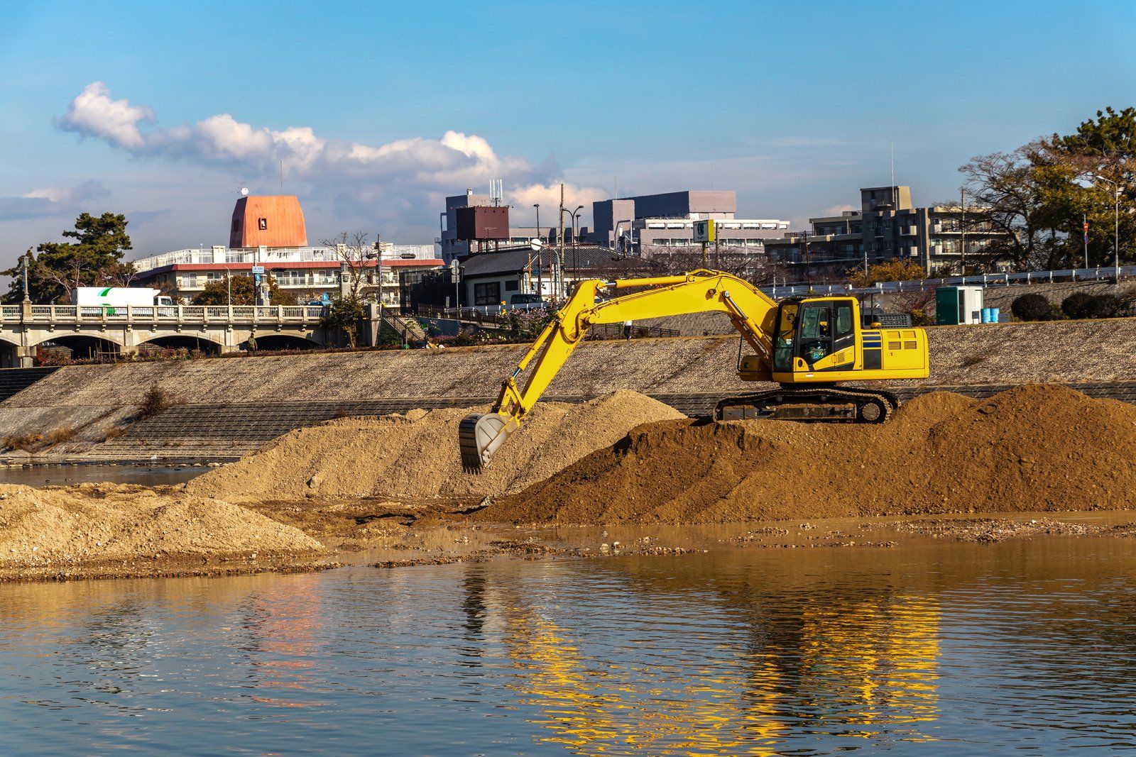 Excavator digging a pond
