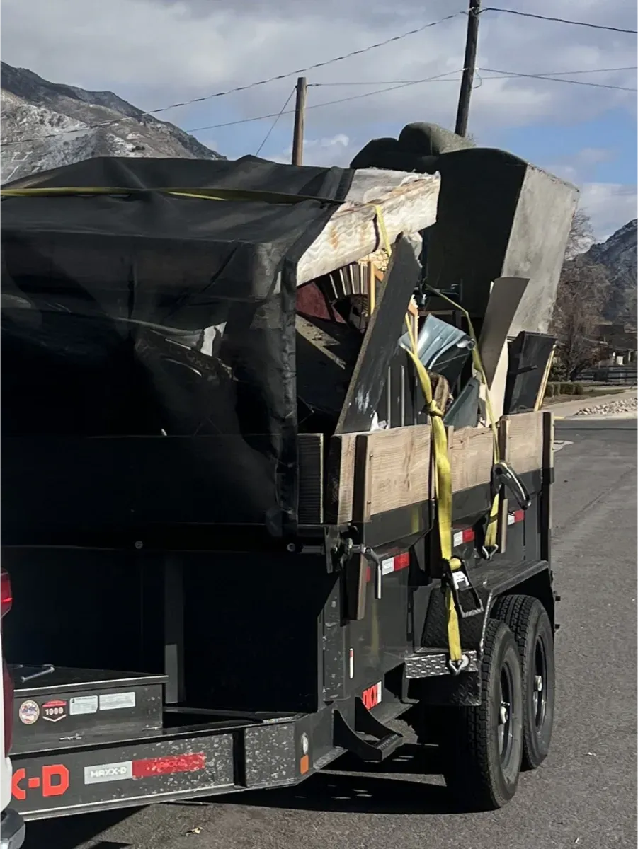 A trailer is loaded with a large piece of wood