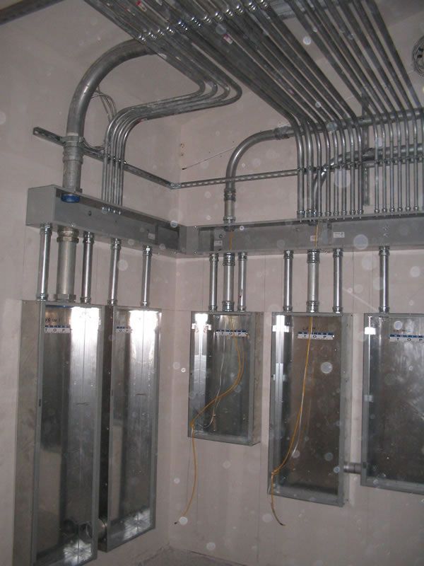 Electrical panels and conduit in a utility room under construction