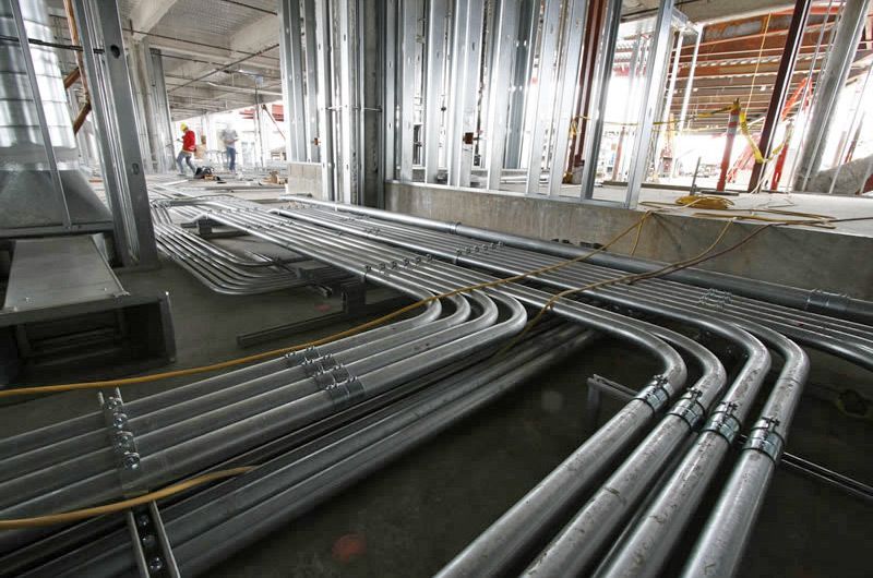 Electrical conduits running through a building under construction