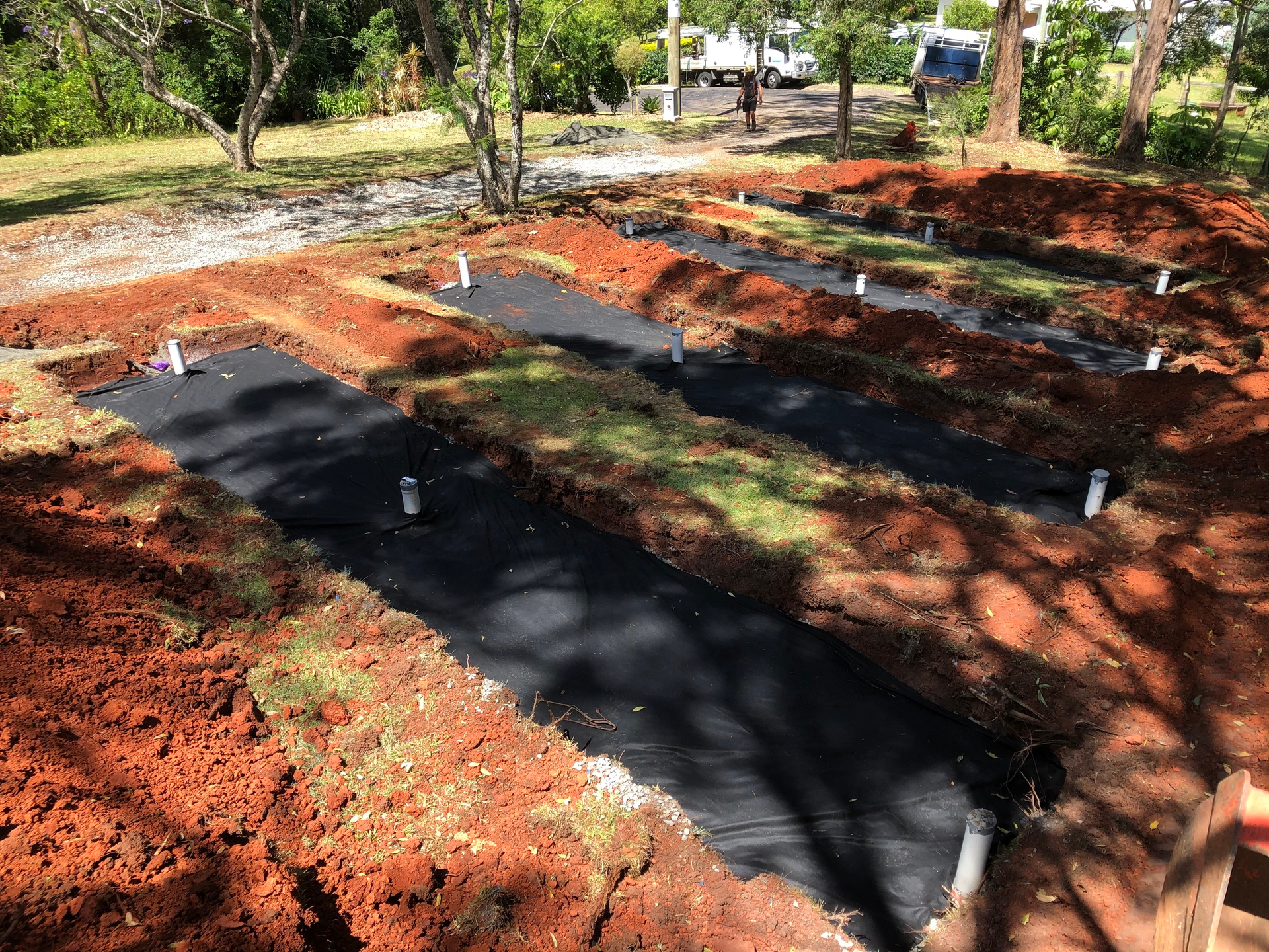A Row of Drains Are Being Installed in a Yard — Bevan Plumbing in South Lismore, NSW