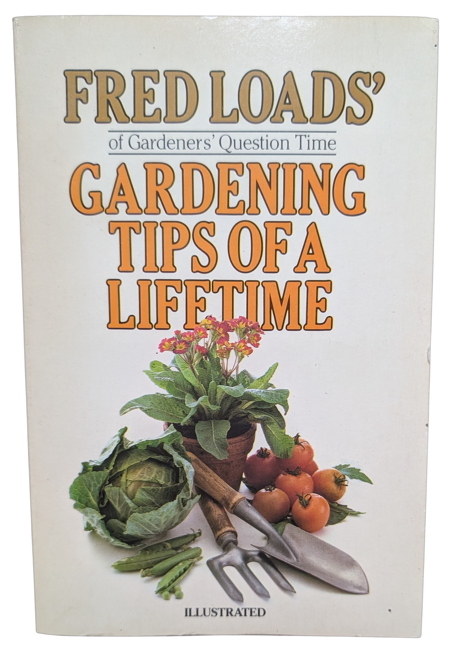 Book cover reading “Fred Loads’ Gardening Tips of a Lifetime,” with vegetables and garden tools on a white background