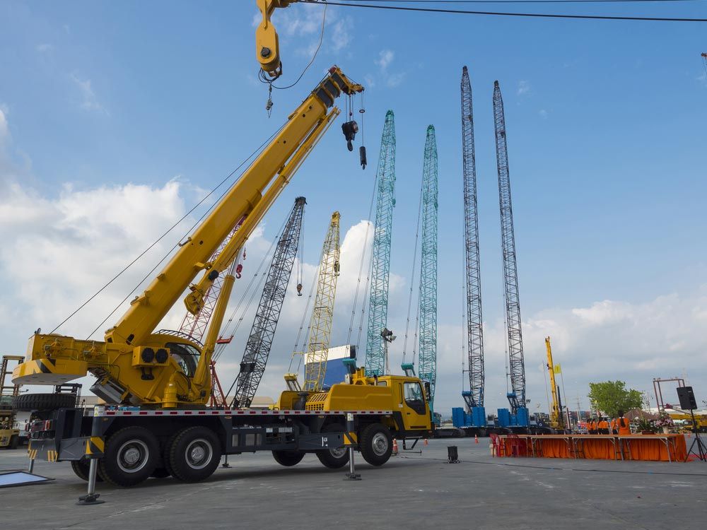 Many Truck And Crane In yard Site Consist Of Lifting, Pulley, Sling, Derrick — Supply Lifting Equipment in Cooroibah, QLD