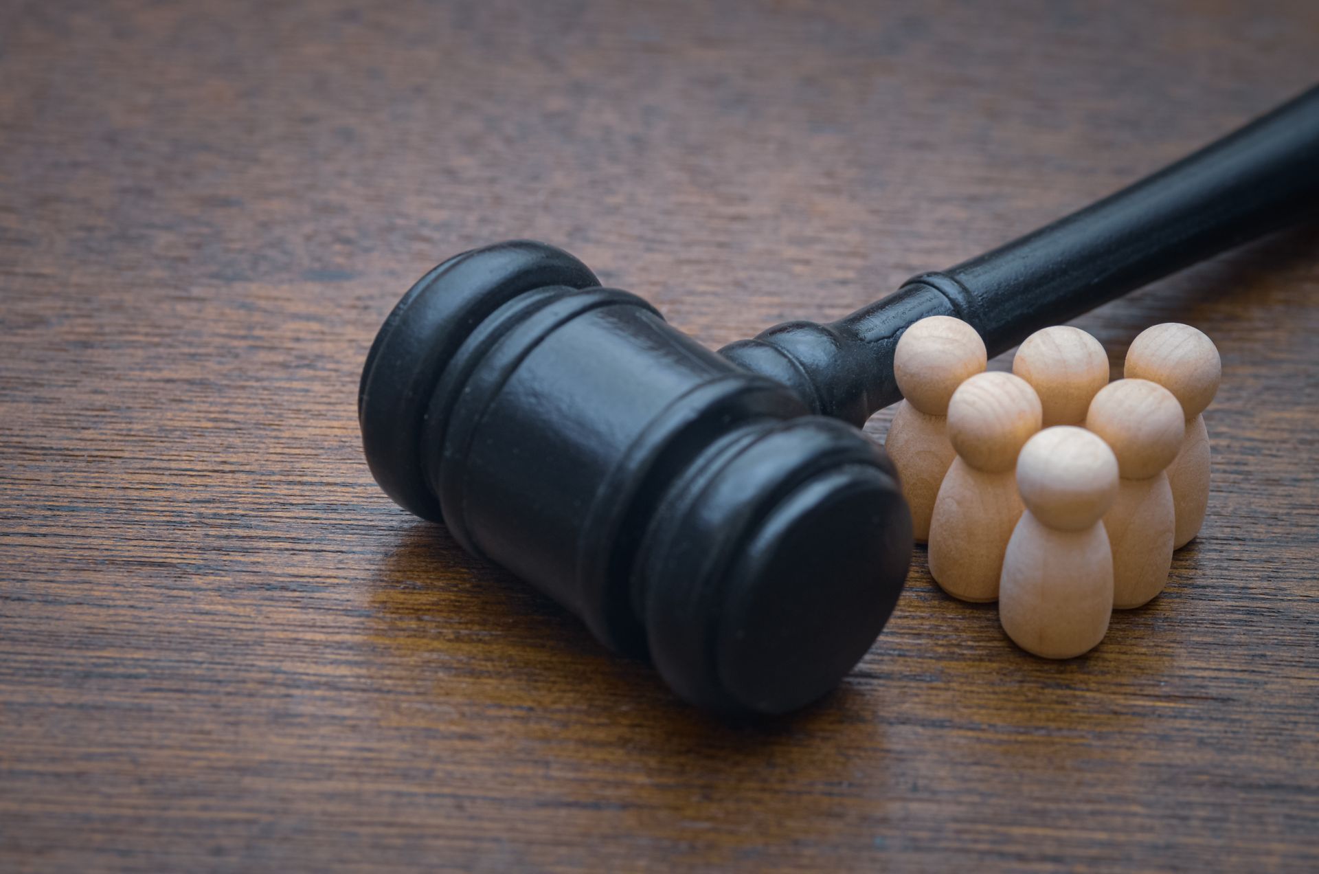 Gavel and wooden figures.