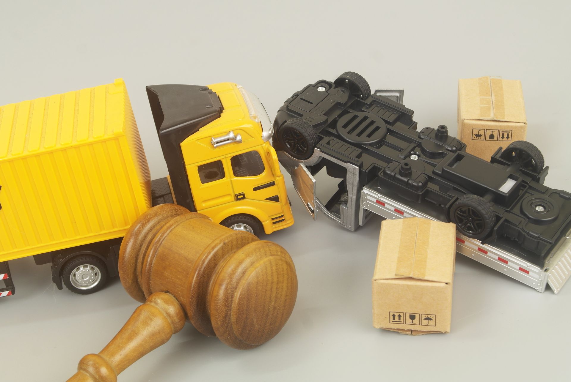 Gavel and toy truck accident