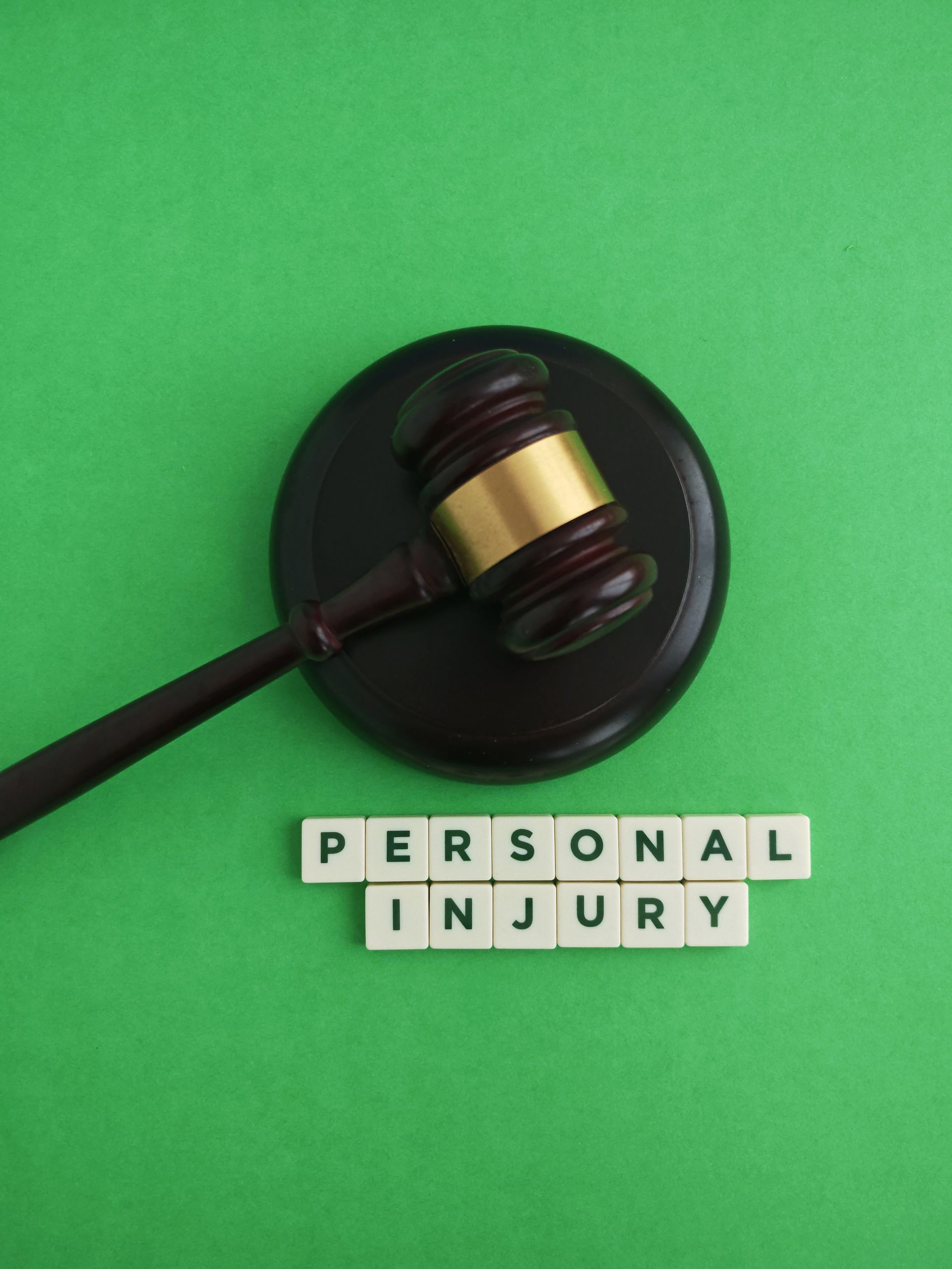 Gavel on a sound block beside 'PERSONAL INJURY.