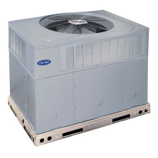A carrier air conditioner is sitting on top of a wooden pallet.