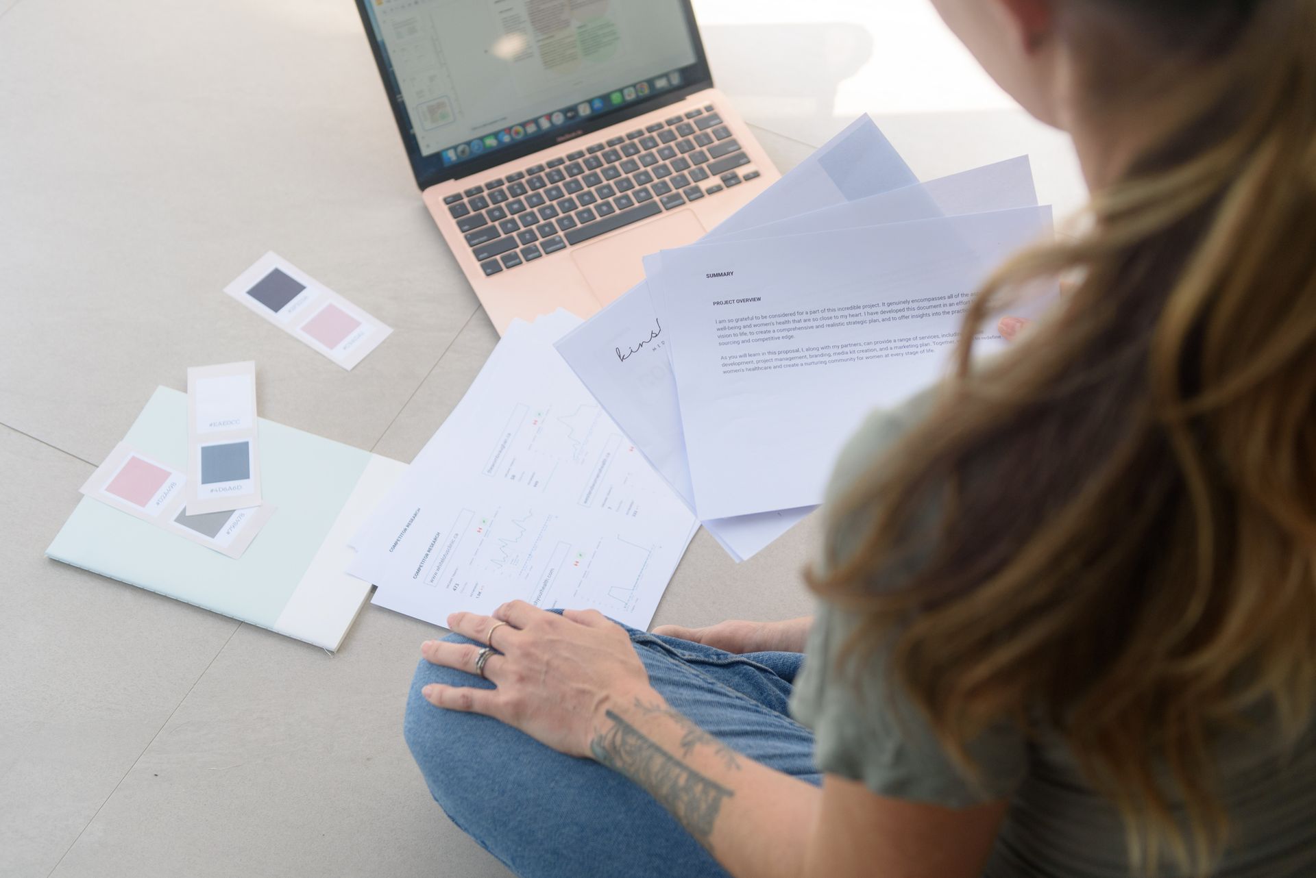 Lauren Spicer from Kinship working on a client's business plan and nline strategy from NYC