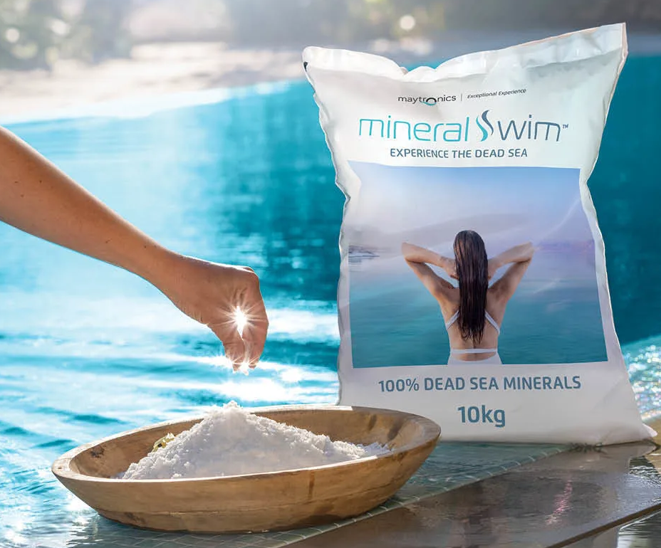 A bag of mineral swim is next to a bowl of salt