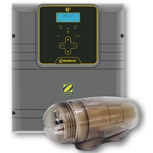A zodiac swimming pool chemical controller with a bottle next to it.